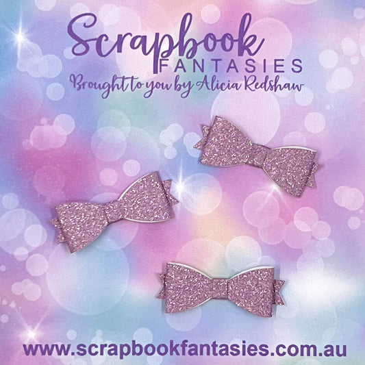 Handmade Dusty Lilac Fine Glitter Mini-Mini Bows (3 pack) by Naomi-Jon Redshaw